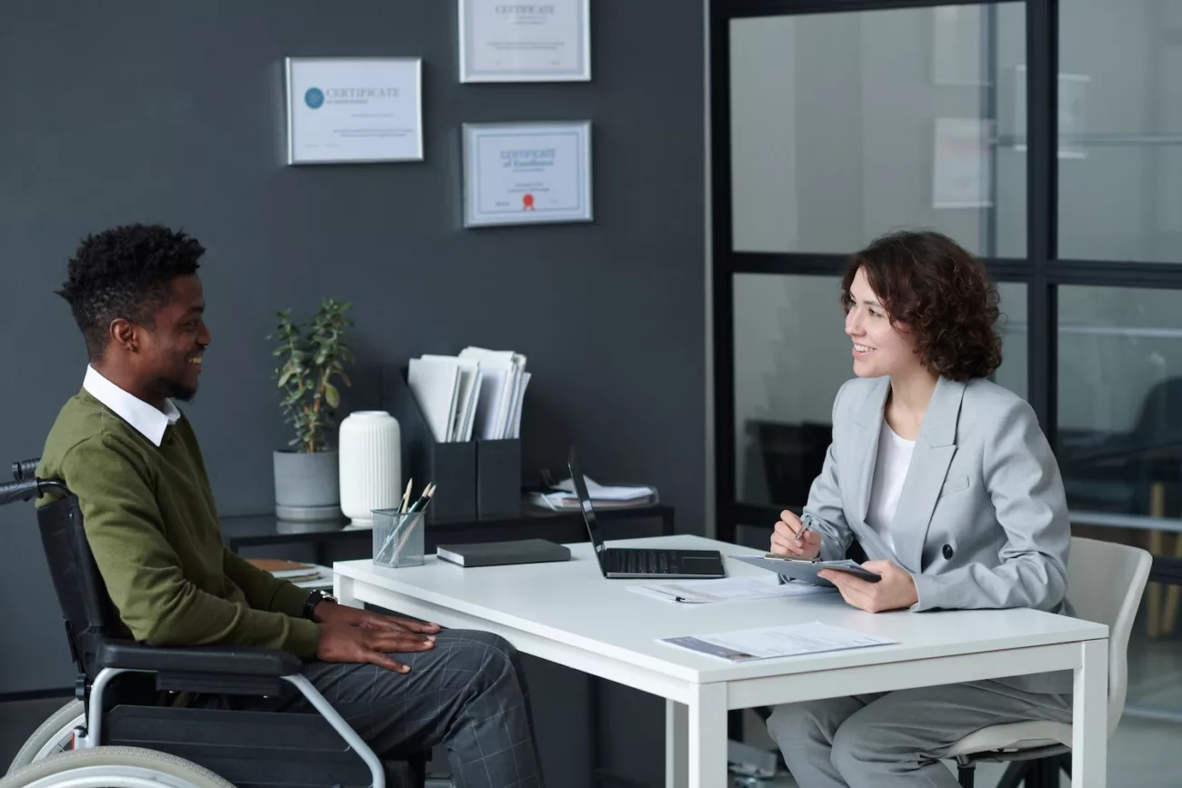 businesswoman interviewing candidate with disability